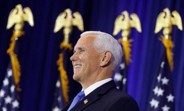 Former U.S. Vice President Mike Pence reacts to an introduction by his wife Karen as he prepares to make a U.S. presidential campaign announcement kicking off his race for the 2024 Republican presidential nomination at a Future Farmers of America "enrichment center" in Ankeny, Iowa, U.S. June 7, 2023. REUTERS/Jonathan Ernst